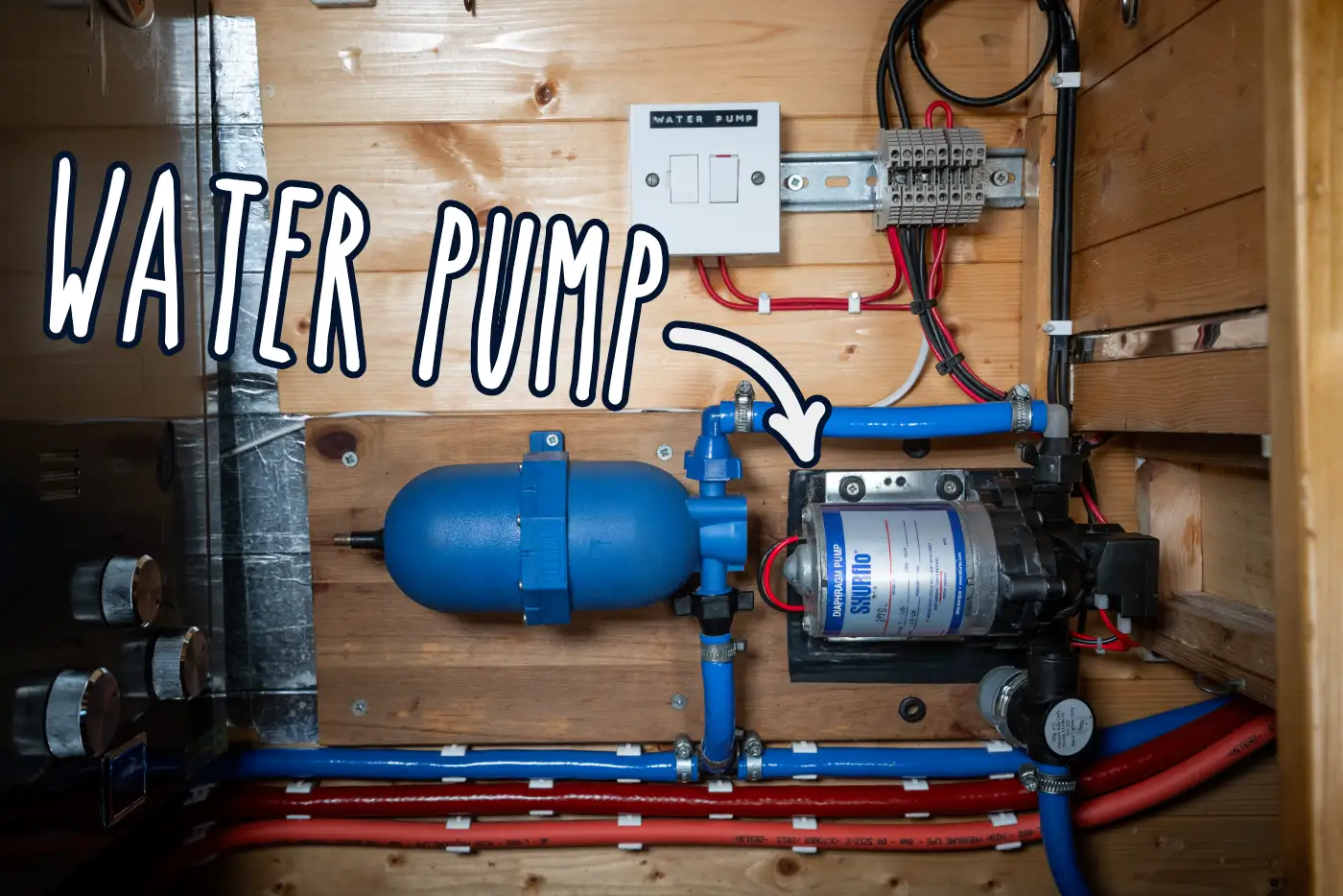Van conversion water system showing water pump, accumulator and pipework