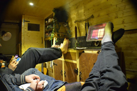 Inside the van parked on the side of a busy street – who’d know?