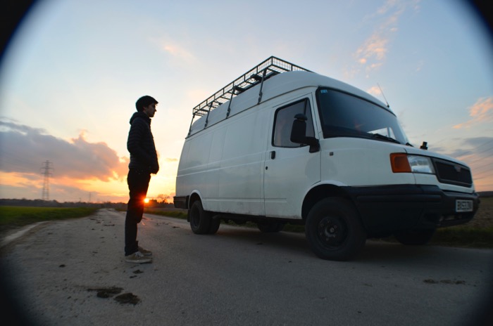 stood outside campervan