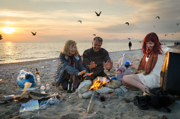 Family having Christmas on beech in Greece